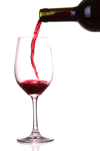 Clear glass and a bottle of red wine