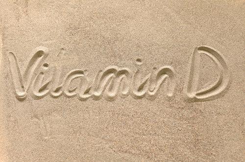 the name and designation drawn in the sand