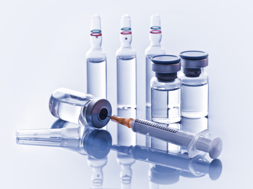 Medicine vials and syringe