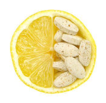 Close up of lemon and pills isolated  vitamin concept - vitamin c