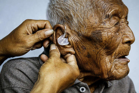 Mr Mbah Gotho getting some help with his hearing aid. The Indonesian claimed he was born in 1870.PHOTO: EUROPEAN PRESSPHOTO AGENCY